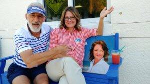 Billi Gartman on her advertisement bench at The Center of Anna Maria Island